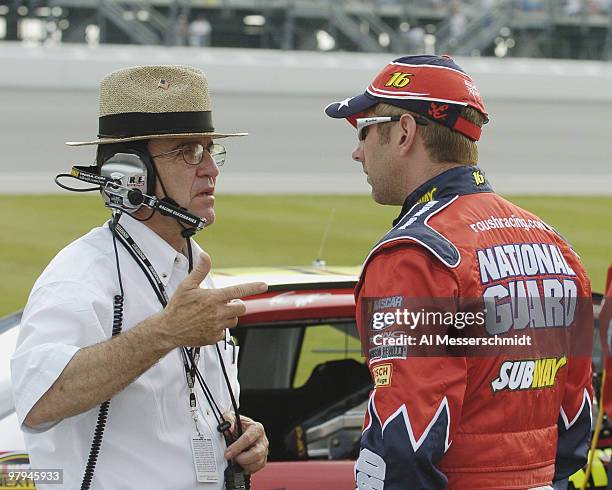 Car owner Jack Roush talks with driver Greg Biffle during qualifying for the NASCAR Nextel Cup Tropicana 400 at Chicagoland Speedway, July 9, 2004.