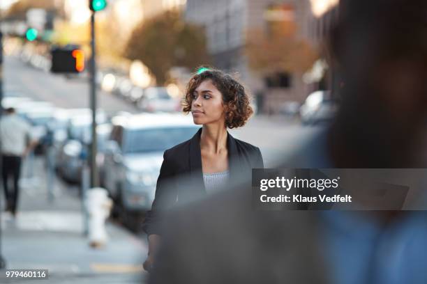 businesspeople walking in pedestrian crossing - crossed stock-fotos und bilder