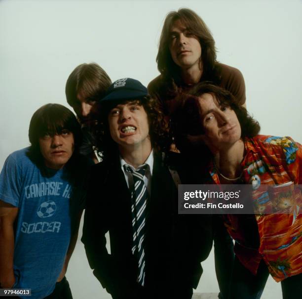 Malcolm Young, Phil Rudd, Angus Young, Bon Scott and Cliff Williams of Australian rock band AC/DC pose in Camden, London in August 1979 .