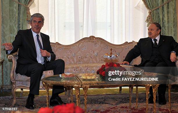 Algerian President Abdelaziz Bouteflika looks at Portugal's Prime Minister Jose Socrates as he gestures during their meeting in Algiers, on March 22,...