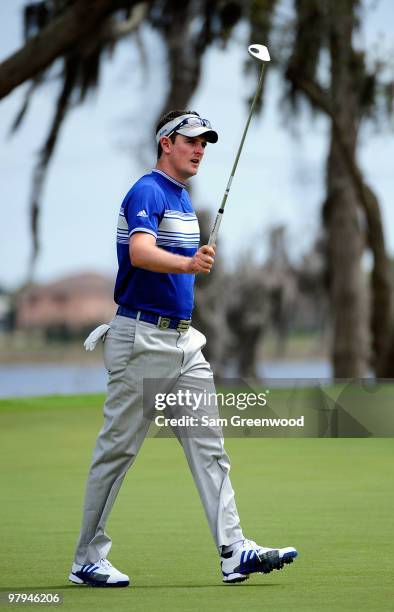 Justin Rose of England celebrates on the 9th green during the first day's play in the 2010 Tavistock Cup at Isleworth Golf and Country Club on March...