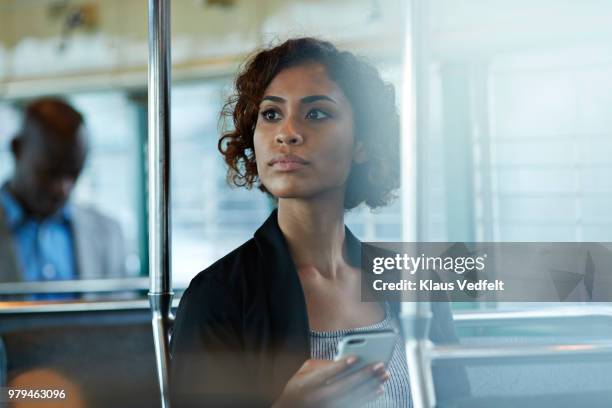 businesswoman looking out of the window of tram in san francisco - people on buses stockfoto's en -beelden