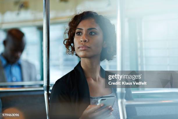 businesswoman looking out of the window of tram in san francisco - reflection in train window stock pictures, royalty-free photos & images