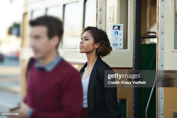 businesswoman leaving tram in san francisco - leaving california stock pictures, royalty-free photos & images