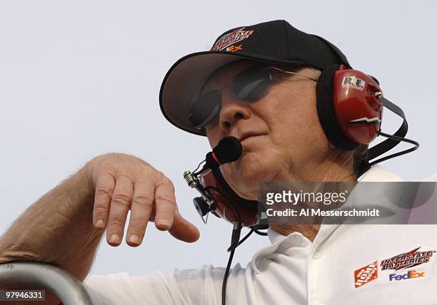 Owner Joe Gibbs watches Tony Stewart practice for the NASCAR NEXTEL Cup series Coca-Cola 600 May 26, 2006 at Lowe's Motor Speedway in Charlotte,...