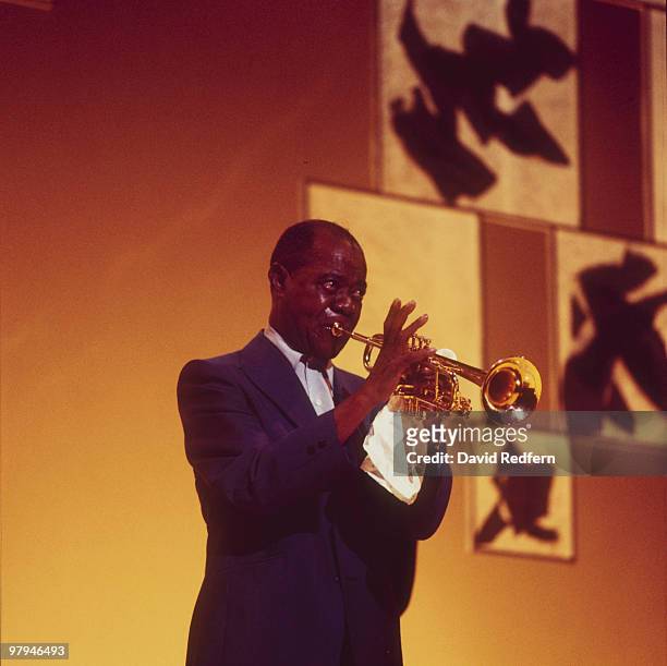 American jazz trumpeter and singer Louis Armstrong performs on stage in November 1970.