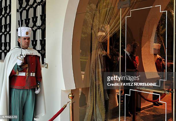An Algerian Presidential guard stands guard during a meeting between unseen Algerian President Abdelaziz Bouteflika and Portugal's unseen Prime...
