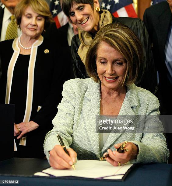 Speaker of the House Rep. Nancy Pelosi signs the Senate Health Reform bill as Rep. Louise Slaughter , and Rep. Rosa DeLauro look on March 22, 2010 on...