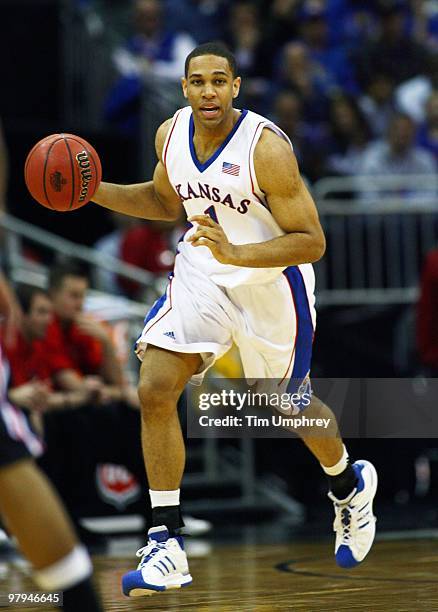 Xavier Henry of the Kansas Jayhawks brings the ball up the court against the Texas Tech Red Raiders during the quarterfinals of the 2010 Phillips 66...