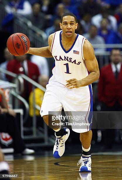 Xavier Henry of the Kansas Jayhawks brings the ball up the court against the Texas Tech Red Raiders during the quarterfinals of the 2010 Phillips 66...