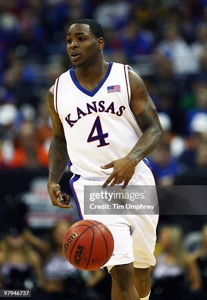 Sherron Collins of the Kansas Jayhawks brings the ball up the court against the Texas Tech Red Raiders during the quarterfinals of the 2010 Phillips...