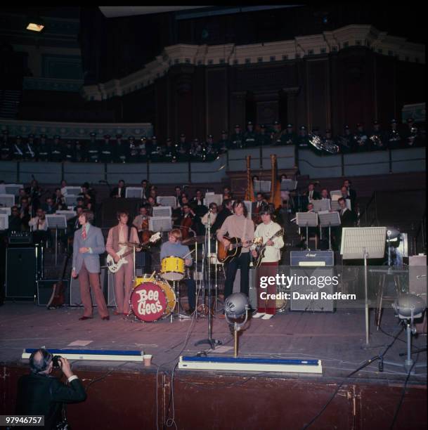 Robin Gibb, Maurice Gibb, Colin Petersen, Barry Gibb and Vince Melouney of the Bee Gees perform on stage in 1968.