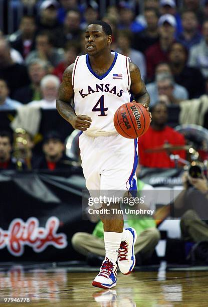 Sherron Collins of the Kansas Jayhawks brings the ball up the court against the Texas Tech Red Raiders during the quarterfinals of the 2010 Phillips...