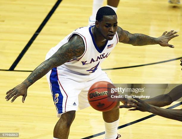 Sherron Collins of the Kansas Jayhawks defends against the Texas Tech Red Raiders during the quarterfinals of the 2010 Phillips 66 Big 12 Men's...