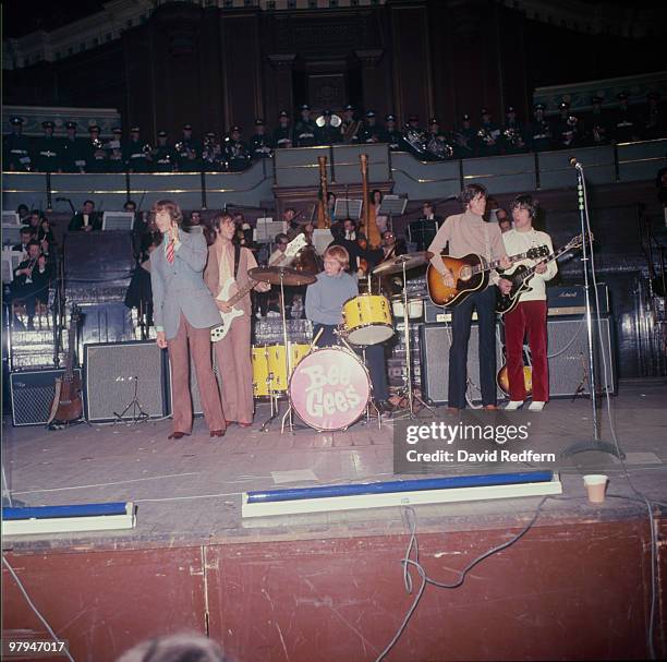 Robin Gibb, Maurice Gibb, Colin Petersen, Barry Gibb and Vince Melouney of the Bee Gees perform on stage in 1968.