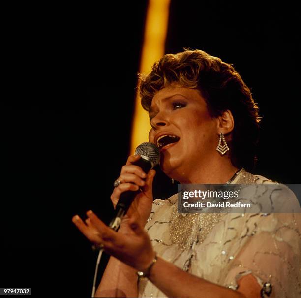 Carroll Baker performs on stage at the Country Music Festival held at Wembley Arena, London in April 1986.