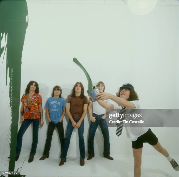Bon Scott, Malcolm Young, Cliff Williams, Phil Rudd and Angus Young of Australian rock band AC/DC pose in Camden, London in August 1979 .