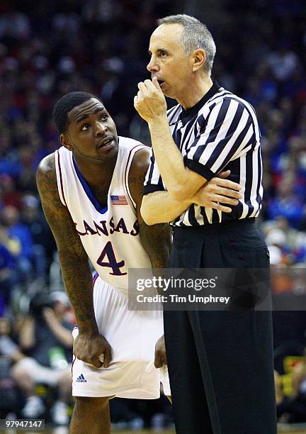 Sherron Collins of the Kansas Jayhawks talks with a referee during the quarterfinals of the 2010 Phillips 66 Big 12 Men's Basketball Tournament...
