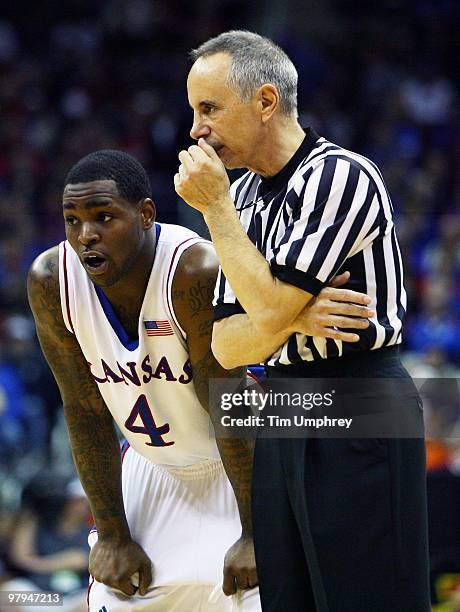 Sherron Collins of the Kansas Jayhawks talks with a referee during the quarterfinals of the 2010 Phillips 66 Big 12 Men's Basketball Tournament...