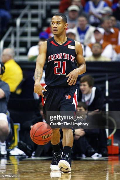 John Roberson of the Texas Tech Red Raiders brings the ball up the court against the Kansas Jayhawks during the quarterfinals of the 2010 Phillips 66...