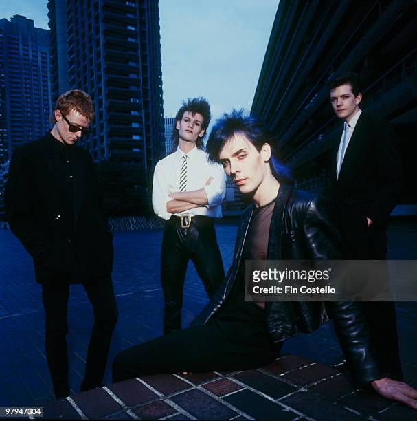 Posed group portrait of Bauhaus in the Barbican. Left to right are David J, Daniel Ash, Peter Murphy and Kevin Haskins in March 1982.