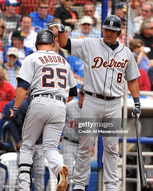 Catcher Gerald Laird of the Detroit Tigers celebrates a home run by infielder Ryan Raburn against the Toronto Blue Jays March 22, 2010 at Dunedin...