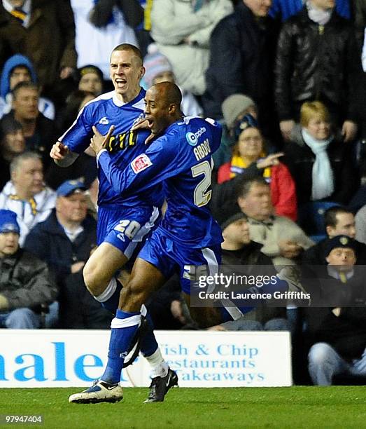 Steve Morison of Millwall is congratulated on scoring the opening goal by teammate Jimmy Abdou during the Coca-Cola League One match between Leeds...