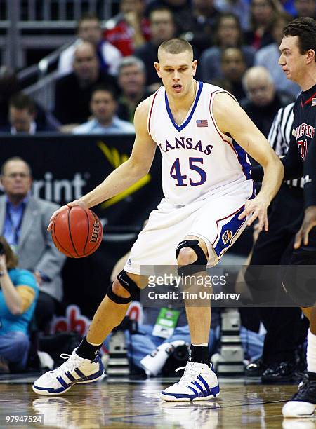 Cole Aldrich of the Kansas Jayhawks tries to muscle his way to the basket against the Texas Tech Red Raiders during the quarterfinals of the 2010...