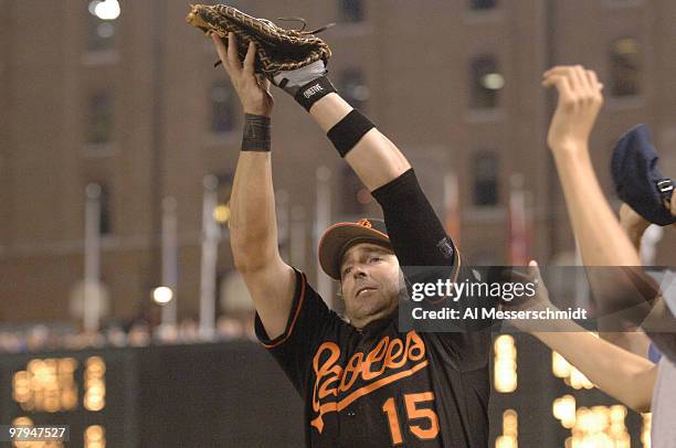 Baltimore Orioles first baseman Kevin Millar grabs a foul ball for an out against the Chicago White Sox July 28, 2006 in Baltimore. The Sox won 6 - 4...