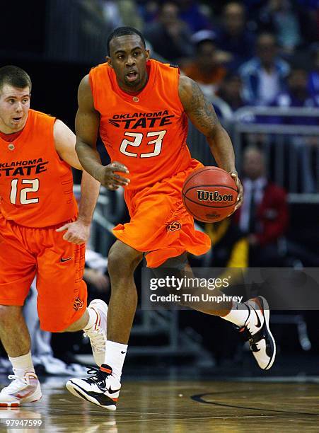 James Anderson of the Oklahoma State Cowboys brings the ball up the court against the Kansas State Wildcats during the quarterfinals of the 2010...