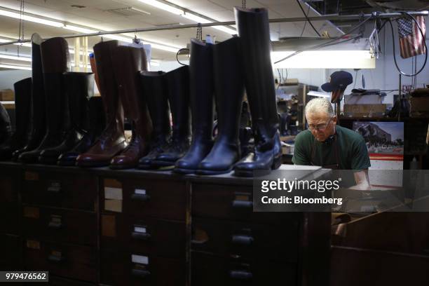 Leather boots sit on a shelf at the Dehner Co. Factory in Omaha, Nebraska, U.S., on Tuesday, June 5, 2018. Markit is scheduled to release...