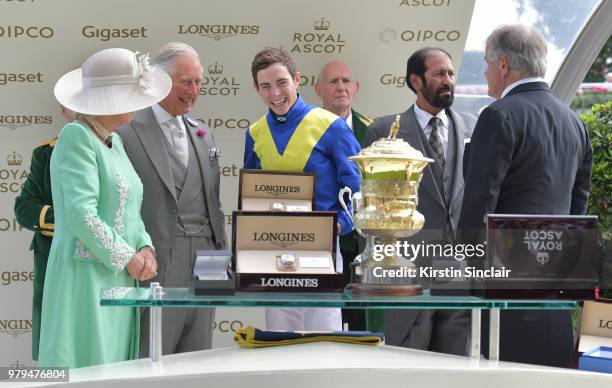 Camilla, Duchess of Cornwall and Prince Charles, Prince of Wales present jockey James Doyle, owner Saeed Suhail and trainer Sir Michael Stoute with...