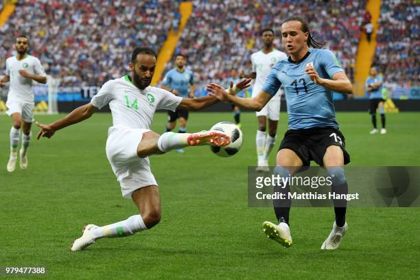 Diego Laxalt of Uruguay challenges Abdullah Otayf of Saudi Arabia during the 2018 FIFA World Cup Russia group A match between Uruguay and Saudi...