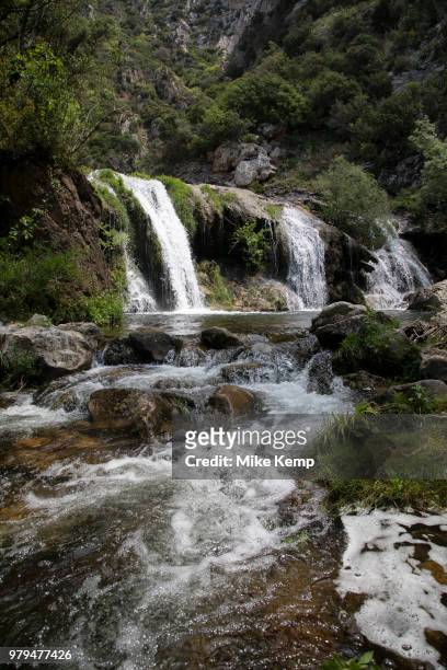 Waterfall flowing down the gorge at Canyon terms, Clue of Terminet into a pool near Termes, France. Termes is a commune in the Aude department in...