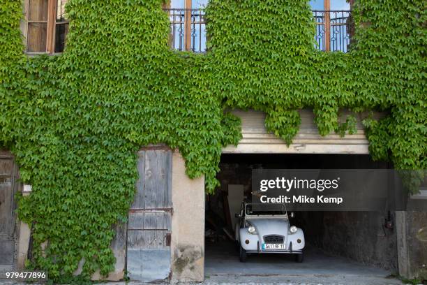 Citroen 2CV vintage car in the medieval village of Lagrasse, Languedoc-Roussillon, France. Lagrasse is known as one of the most beautiful French...