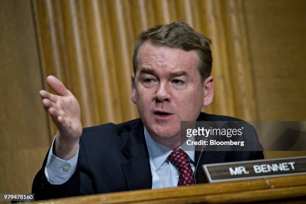 Senator Michael Bennet, a Democrat from Colorado, questions Wilbur Ross, U.S. Commerce secretary, not pictured, during a Senate Finance Committee...