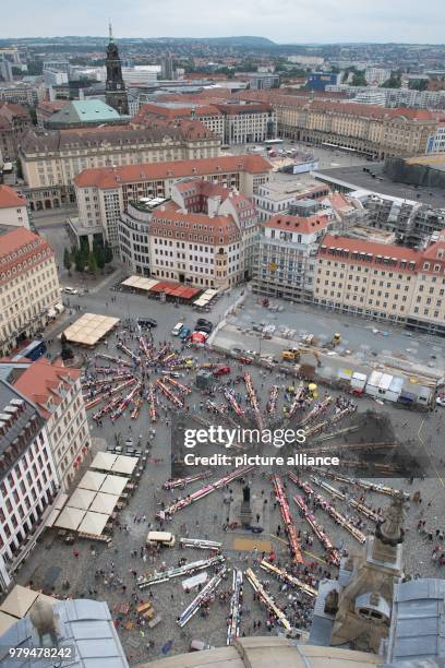 June 2018, Germany, Dresden: Numerous tables are set up at the Neumarkt square on the occasion of the event 'Gastmahl fuer alle' . Already for the...