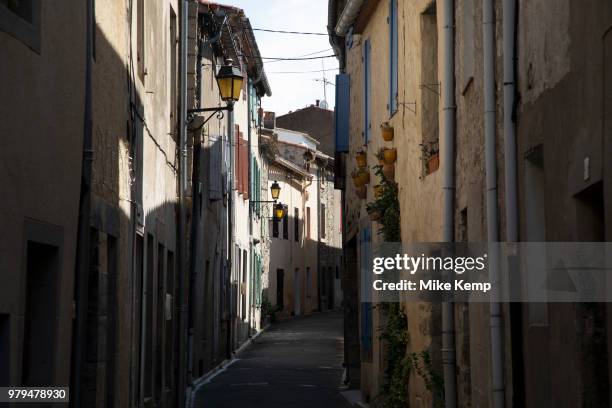 Scene in the medieval village of Lagrasse, Languedoc-Roussillon, France. Lagrasse is known as one of the most beautiful French villages. It lies in...