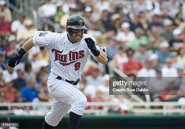 Nick Punto of the Minnesota Twins runs out a hit in a game against the Tampa Bay Rays at Lee County Sports Complex on March 21, 2010 in Fort Myers,...