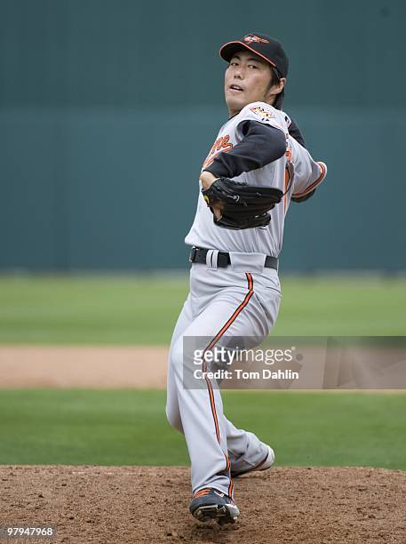 Koji Uehara of the Baltimore Orioles pitches against the Minnesota Twins at Lee County Sports Complex on March 16, 2010 in Fort Myers, Florida.