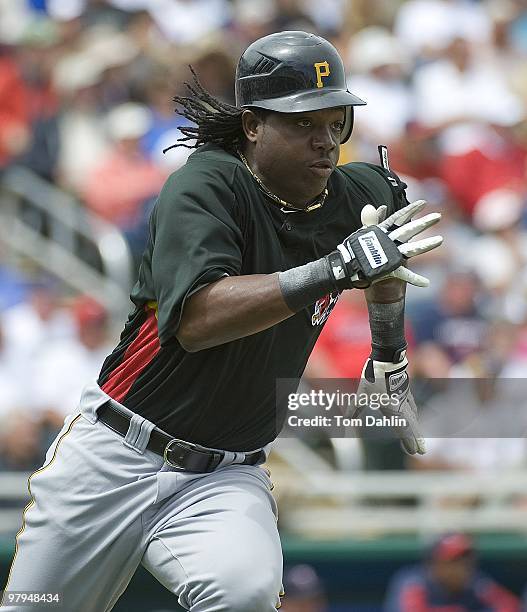 Lastings Milledge of the Pittsburgh Pirates runs out a hit against the Minnesota Twins at Lee County Sports Complex on March 18, 2010 in Fort Myers,...