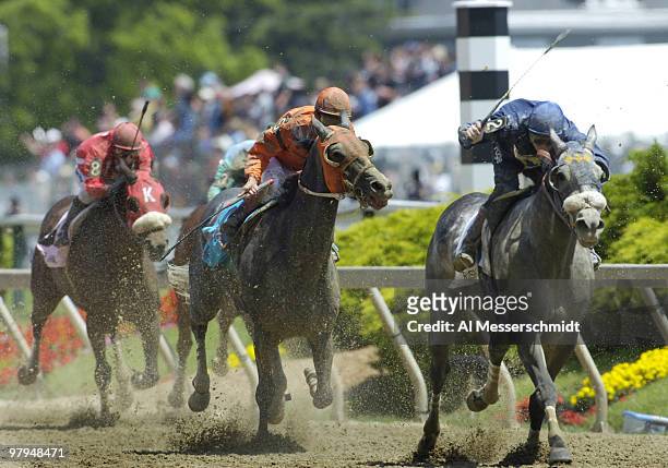 Jockeys Ryan Fogelsonger and Edgar Prado battle for position at Pimlico Racetrack. Later, the Baltimore, Maryland track will hold the 131st running...