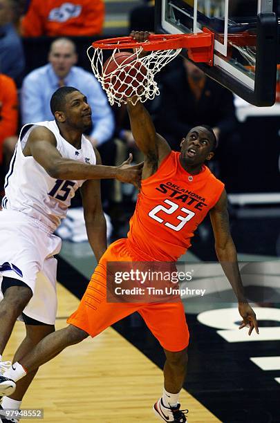 James Anderson of the Oklahoma State Cowboys dunks the ball against the Kansas State Wildcats during the quarterfinals of the 2010 Phillips 66 Big 12...