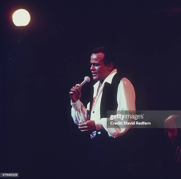 American singer and actor Harry Belafonte performs live on stage during the Royal Variety Performance at the Palladium Theatre in London on 21st...