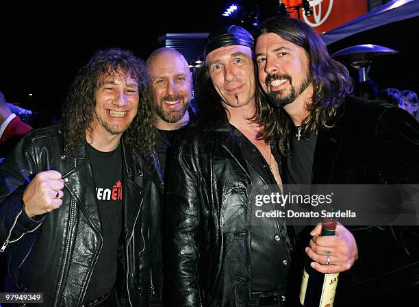 Musicians Steve Kudlow, Glenn Five, Robb Reiner of Anvil with Dave Grohl attend the ELLE Green Room at the 25th Film Independent Spirit Awards held...