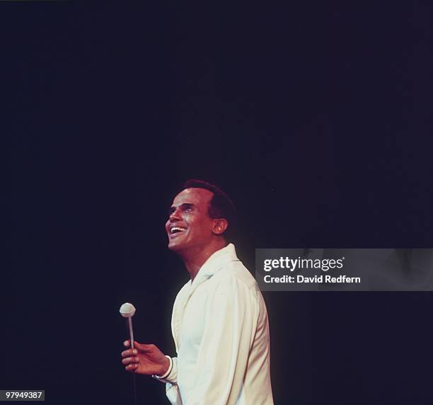 American singer and actor Harry Belafonte performs live on stage during the Royal Variety Performance at the Palladium Theatre in London on 21st...