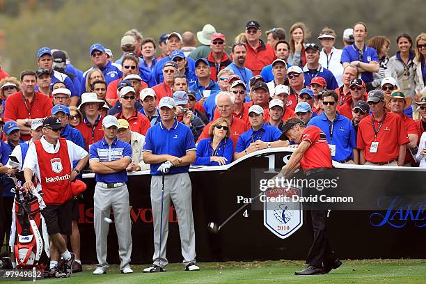 Stuart Appleby of Australia and the Isleworth team drives from the 18th tee watched by his opponents Ernie Els of South Africa and Trevor Immelman of...