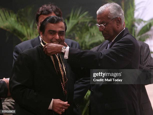 Mukesh Ambani, Chairman and MD of Reliance Industries Limited being awarded the IMC Juran Quality Medal by Rajya Sabha MP Ashok Ganguly at an award...