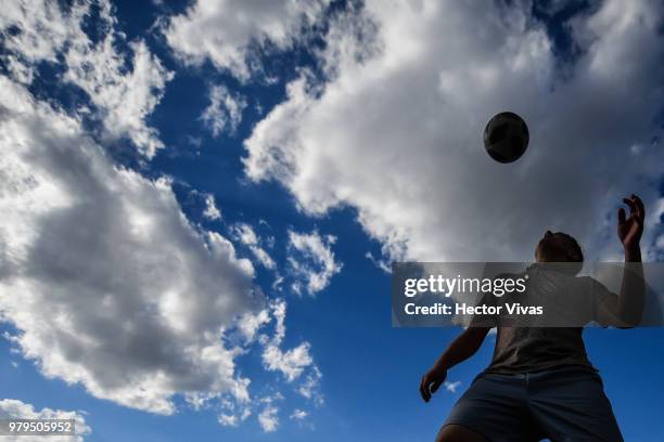 Young russian man dominates the ball in Gorky Park on June 20, 2018 in Moscow, Russia.