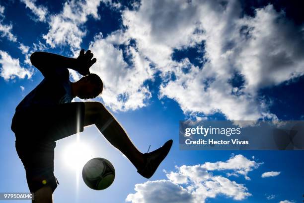 Young russian man dominates the ball in Gorky Park on June 20, 2018 in Moscow, Russia.
